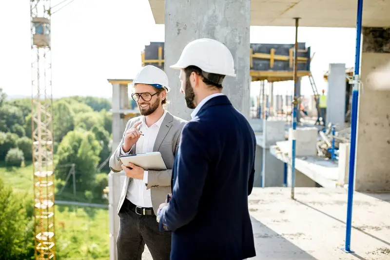 Construction Management in Winston-Salem, NC – Built for Results, Backed by Experience 3 architects meeting at job site
