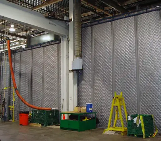 Industrial noise curtain installed in an operating distribution facility